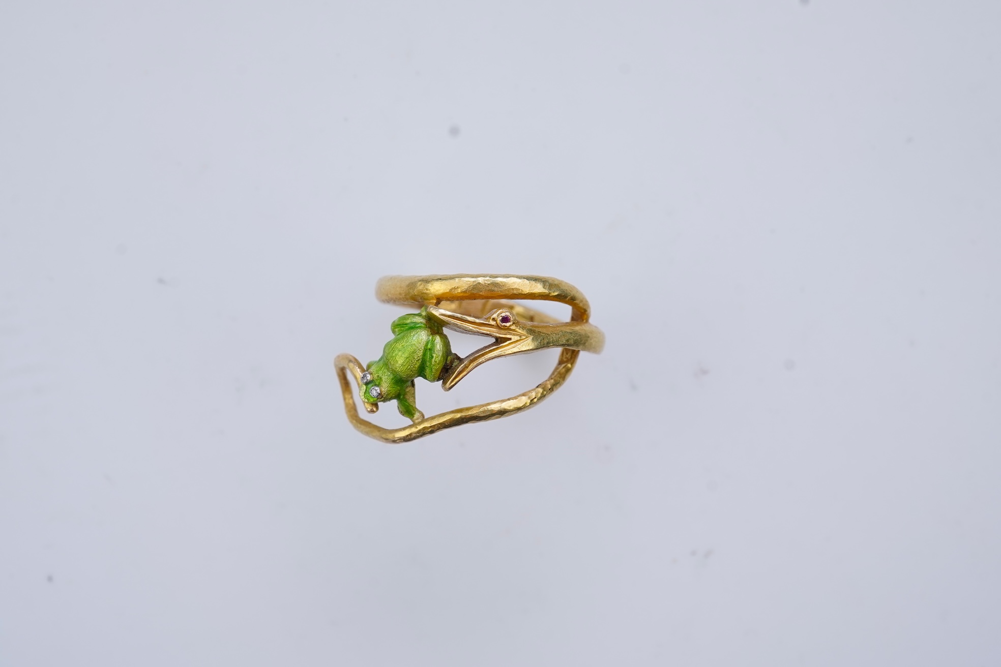 An unusual gold and enamel novelty ring